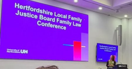 Danielle Peters welcoming guests to the HFJB Conference