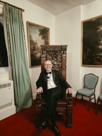 Hertfordshire Law Society President Michael Scutt enjoys sitting on an antique throne at Hatfield House!
